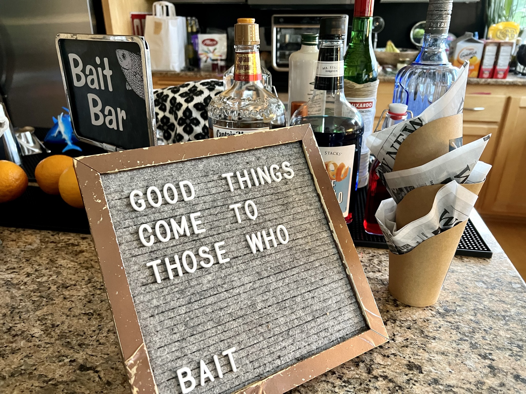 fish lure coming out of a bottle of alcohol Cackalacky Booze Bait Fishing bottle caps and comes with a set of How To instructions Host a Cocktail Party with